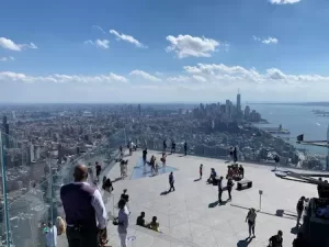 The Empire State Building’s observation deck with glowing lights, offering breathtaking views of the city.